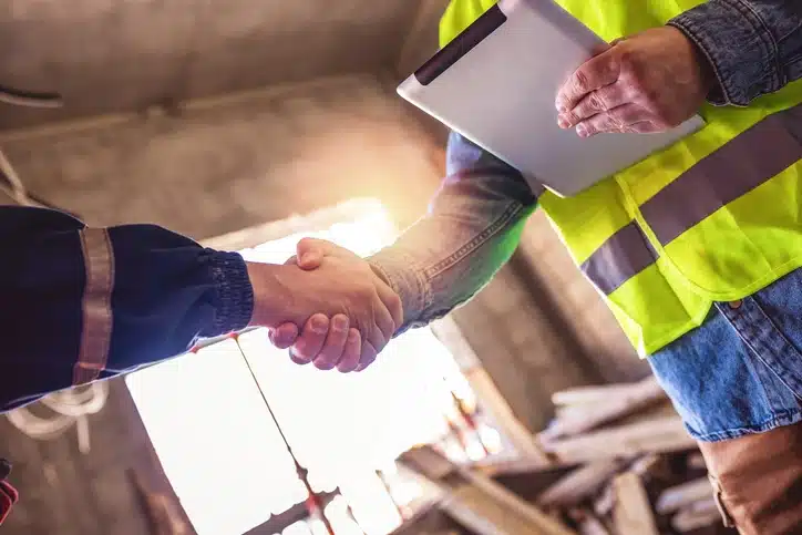 Handshake with co workers adhering to leadership challenges and solutions.