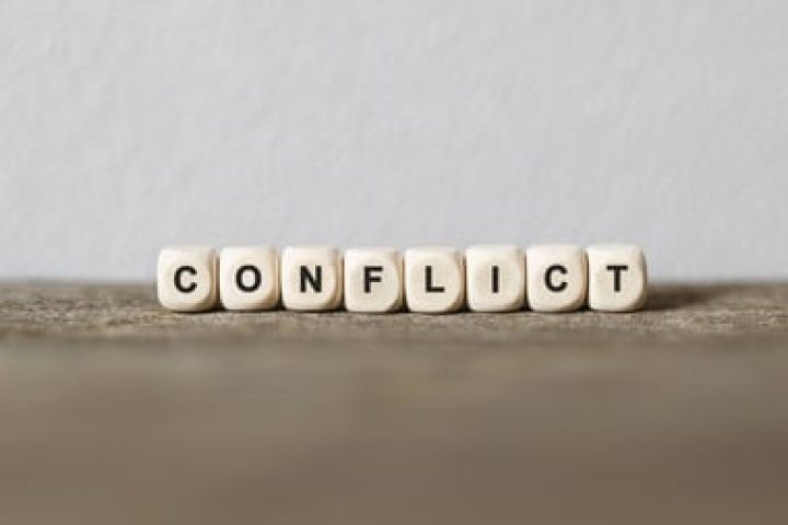 Word CONFLICT made with wood building blocks,stock image