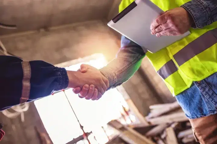 Handshake with co workers adhering to leadership challenges and solutions.